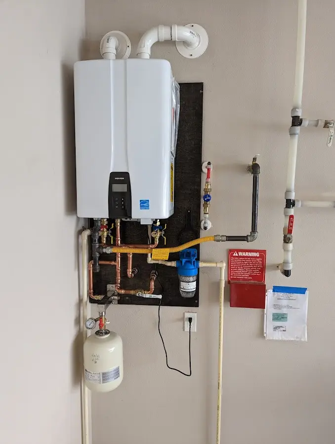 Professional plumber installing copper piping in a Annetta home